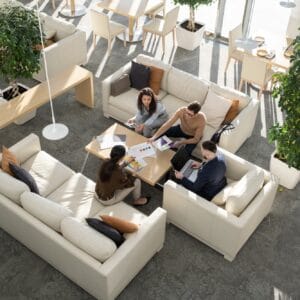 Group of young auditors of high tech corporation discussing documents